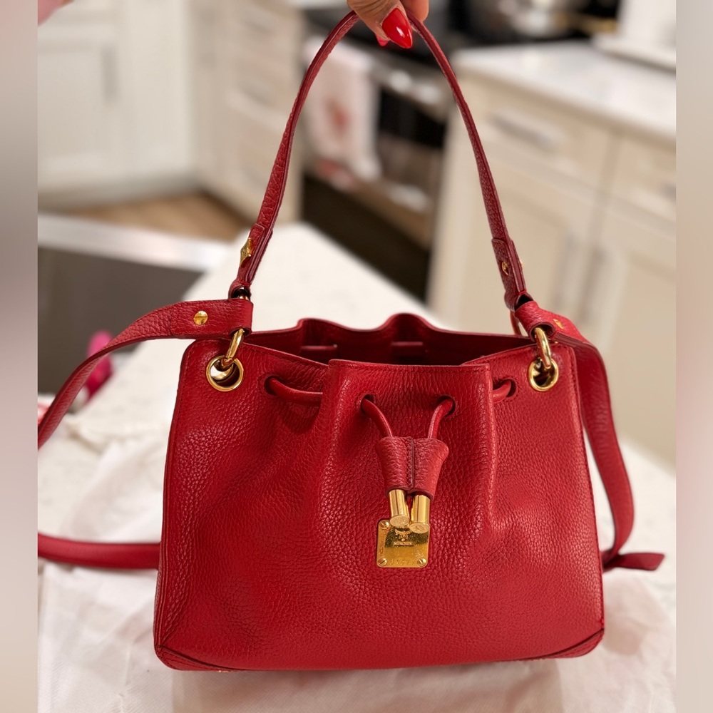 MCM Red Leather Bucket Bag
Crossbody Drawstring Gold Hardware